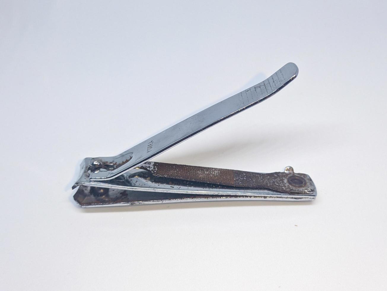 A close up of nail clippers with white background photo