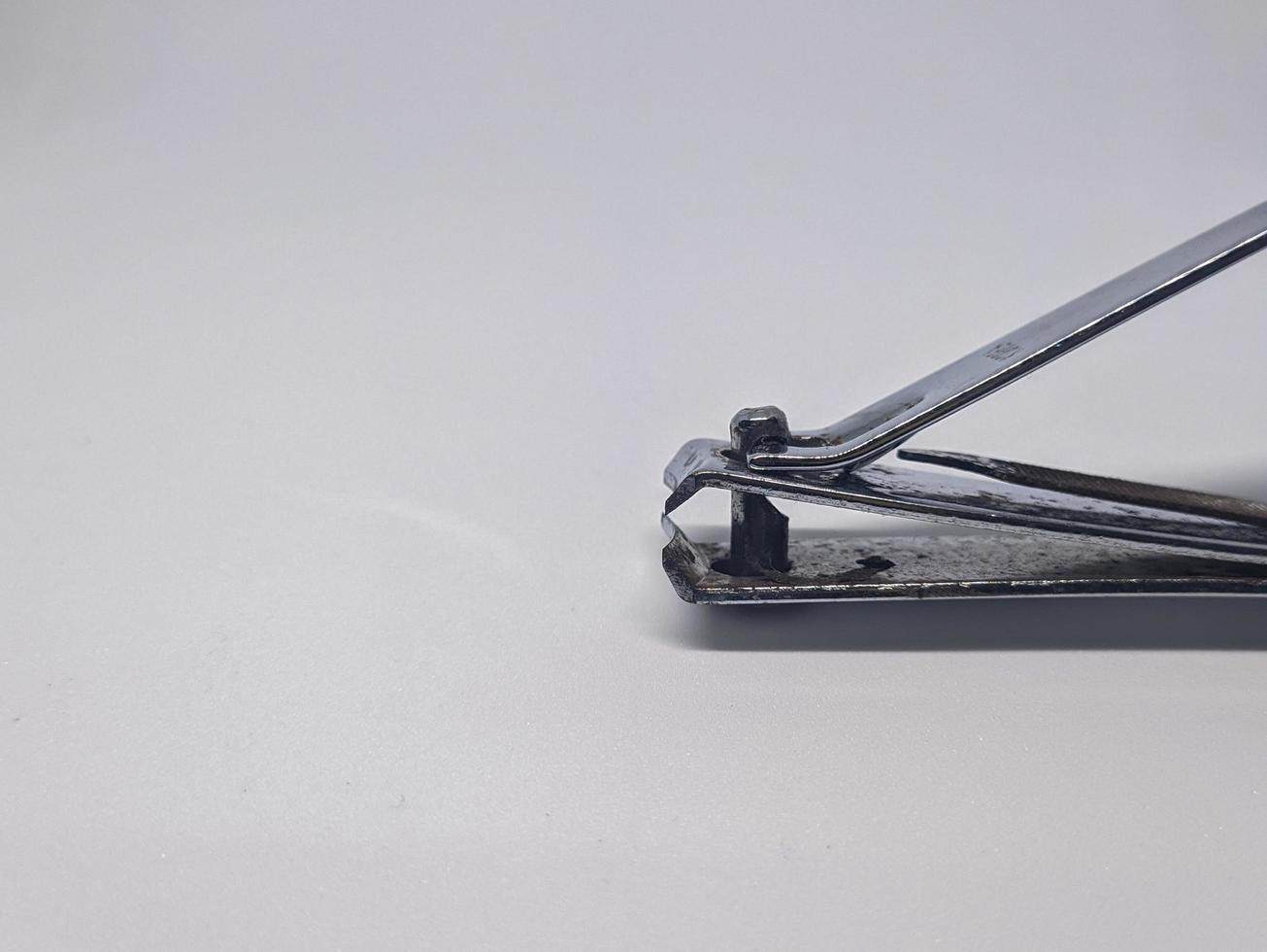 A close up of nail clippers with white background photo