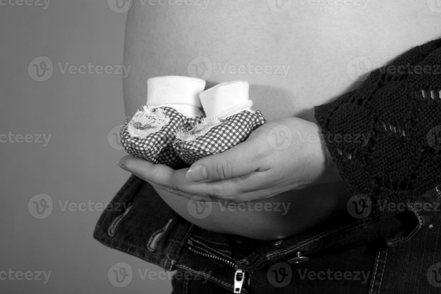 pregnancy with baby booties photo