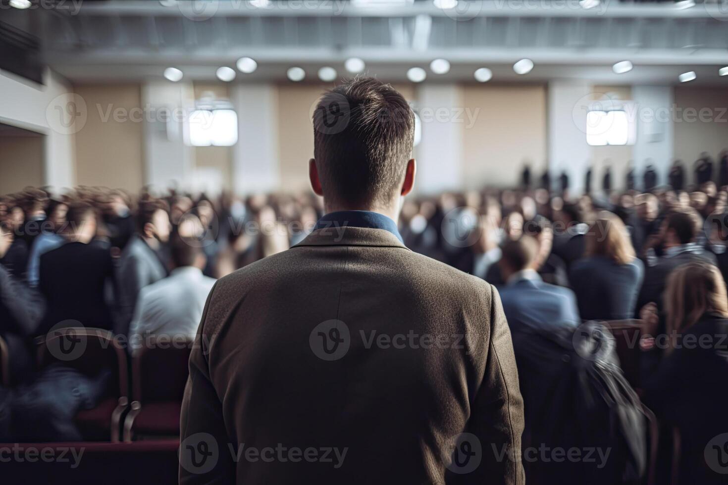 Public speaker giving talk in conference hall at business event. photo