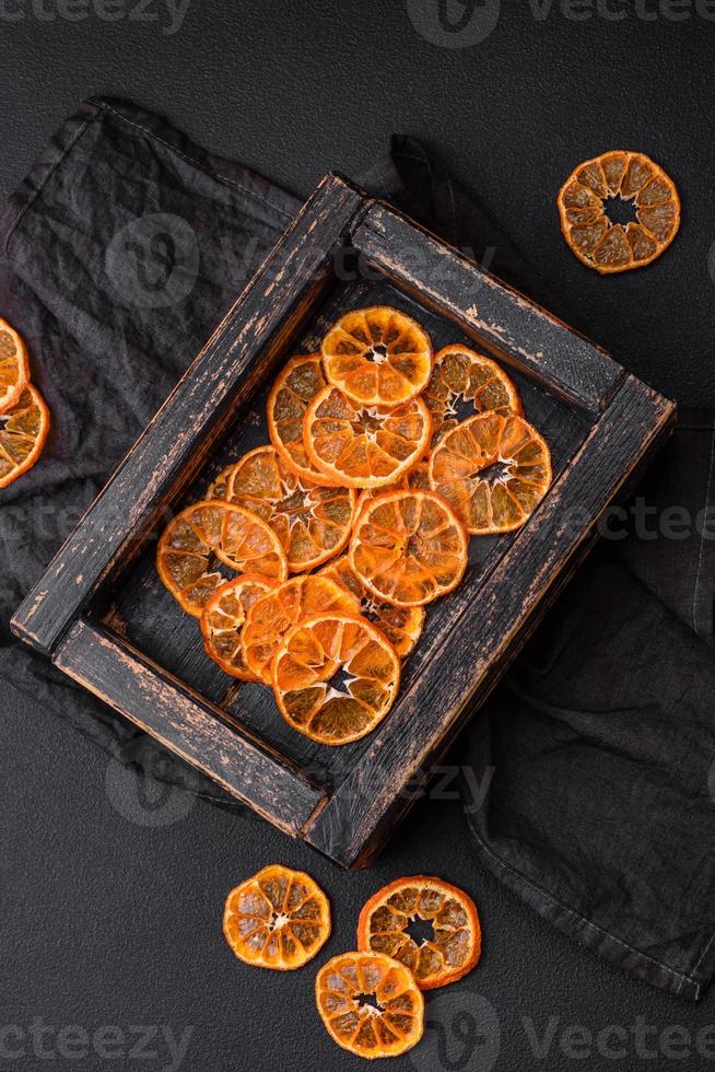 Beautiful Christmas decoration consisting of an old wooden box with dried citrus fruits photo