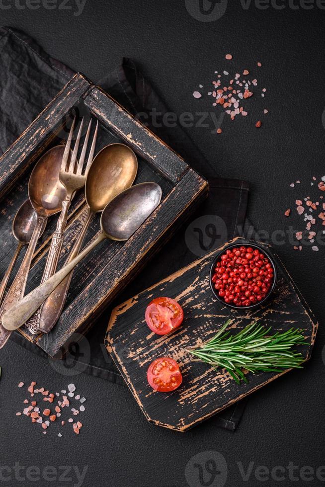 Vintage rectangular shabby wooden box with spoons and forks photo