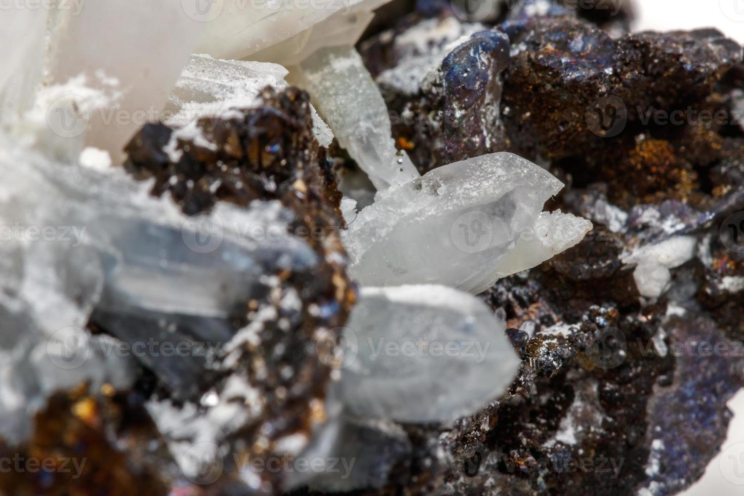 Macro mineral stone Drusus quartz with sphalerite in the rock a white background photo