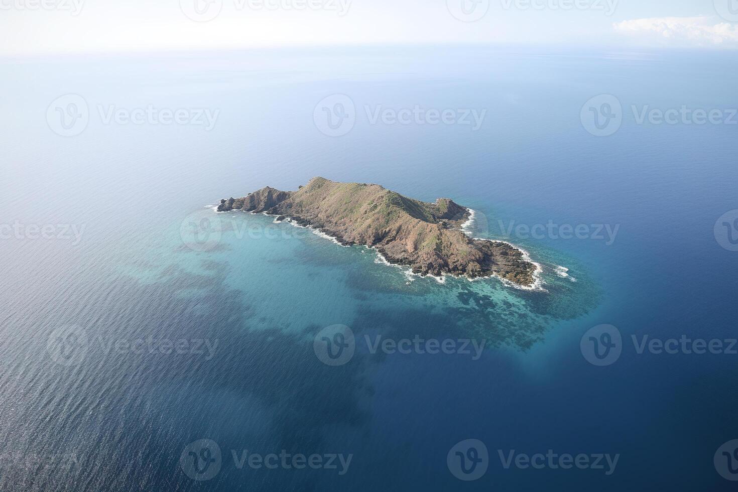 Aerial view of a small island in the middle of the ocean. photo