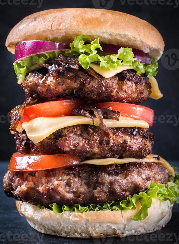 Burger close-up on dark background photo