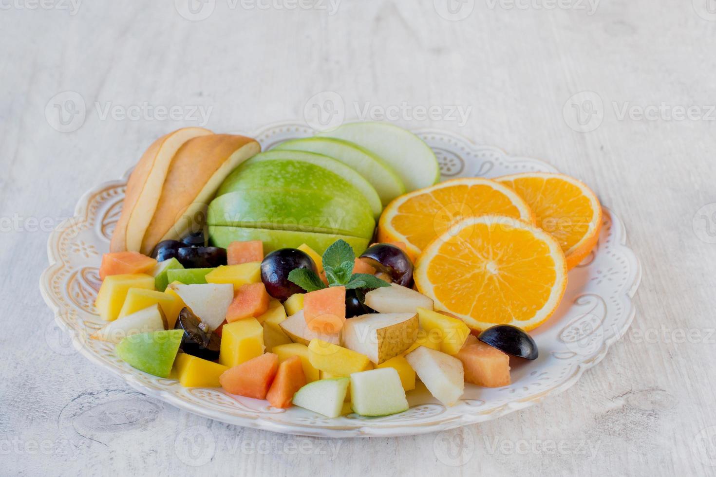 Fresh fruit salad on a plate photo