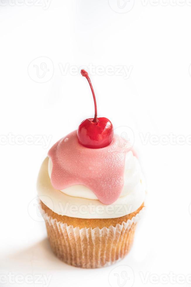 Vanilla cup cake with cherry photo