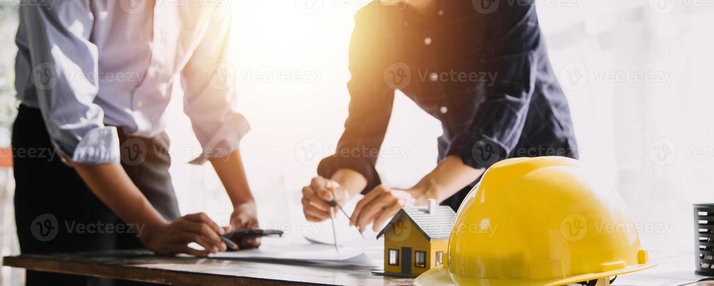 Architect concept, Architects working with blueprints in the office, Vintage Effect photo