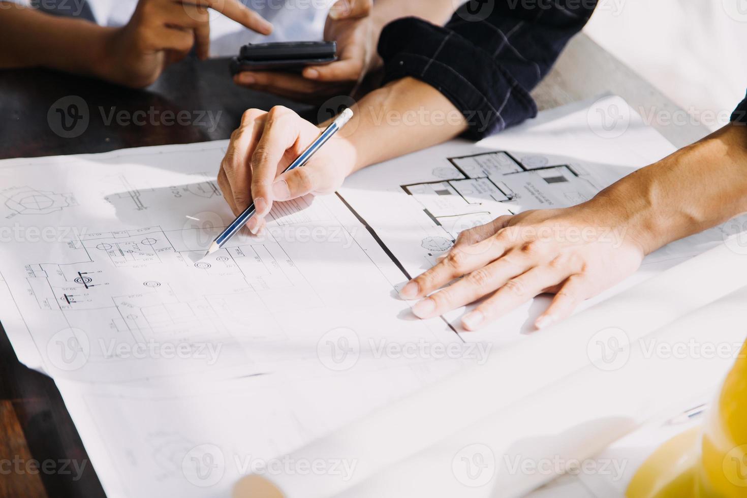 Architect concept, Architects working with blueprints in the office, Vintage Effect photo