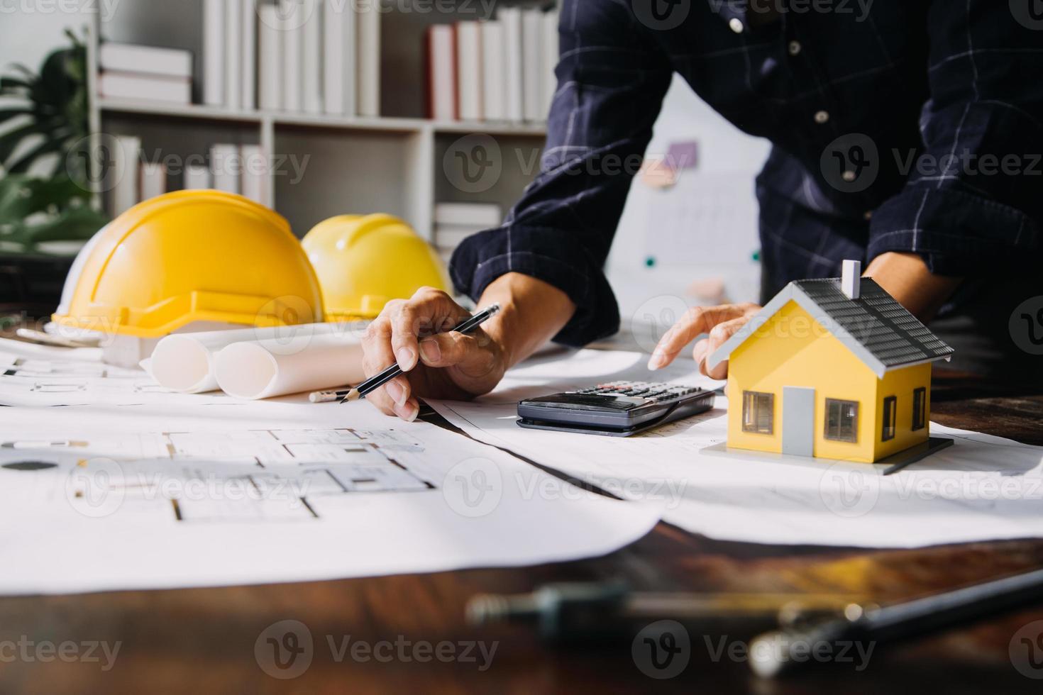 Architect concept, Architects working with blueprints in the office, Vintage Effect photo