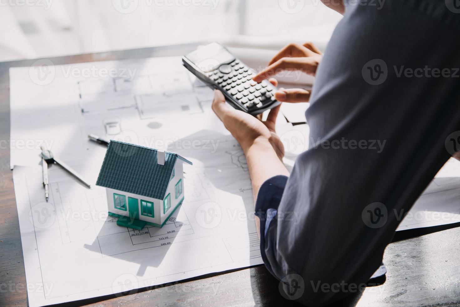 Architect concept, Architects working with blueprints in the office, Vintage Effect photo