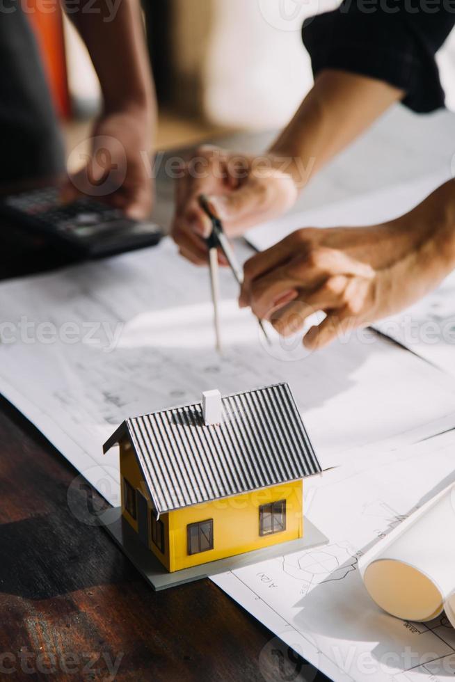 Architect concept, Architects working with blueprints in the office, Vintage Effect photo