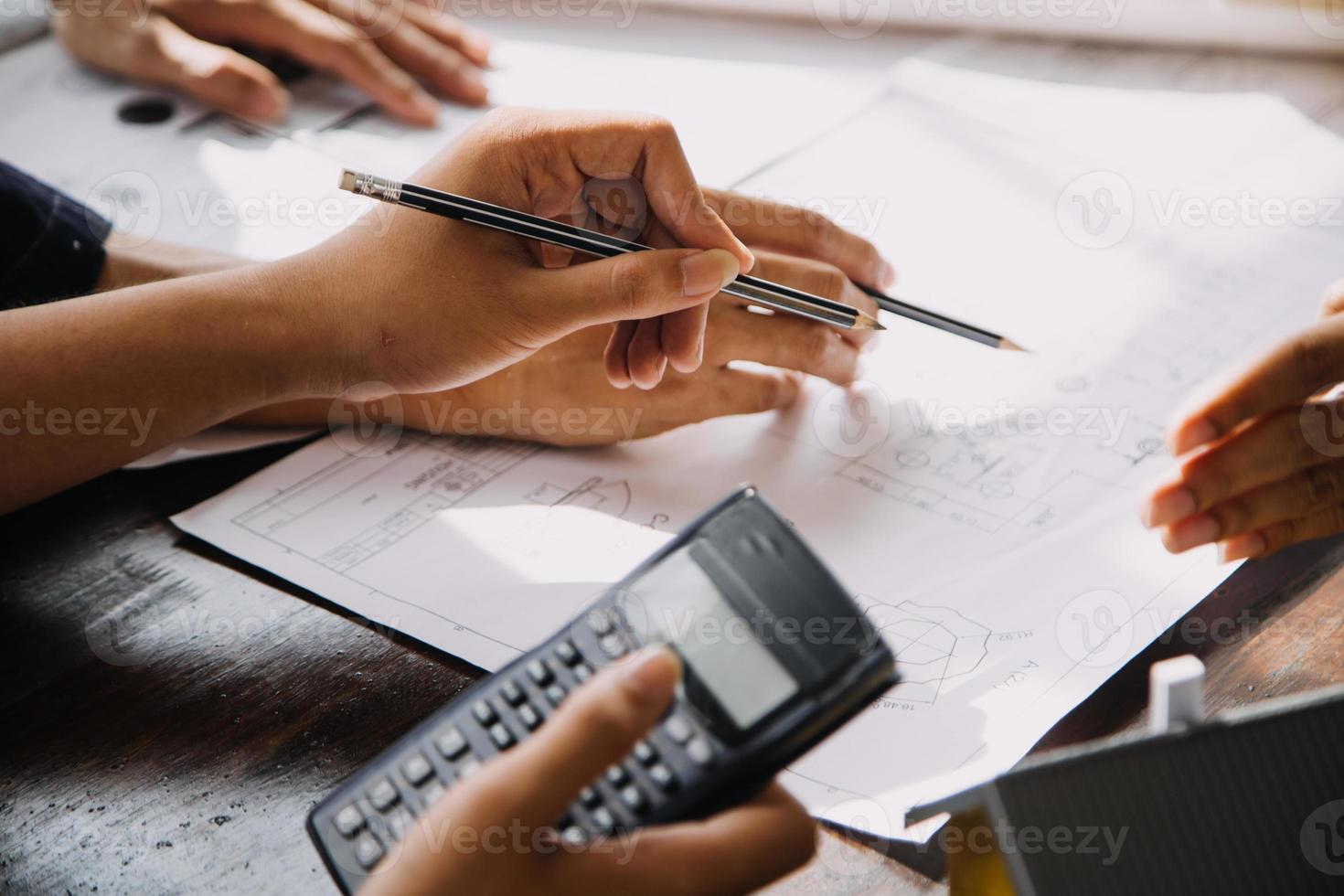 Architect concept, Architects working with blueprints in the office, Vintage Effect photo