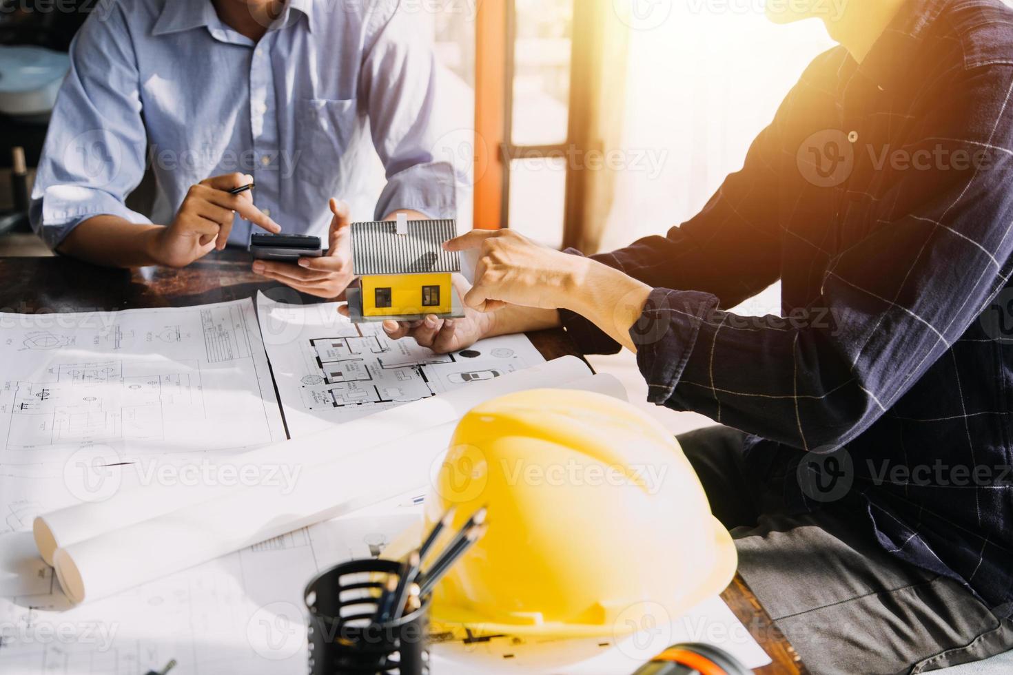 Architect concept, Architects working with blueprints in the office, Vintage Effect photo