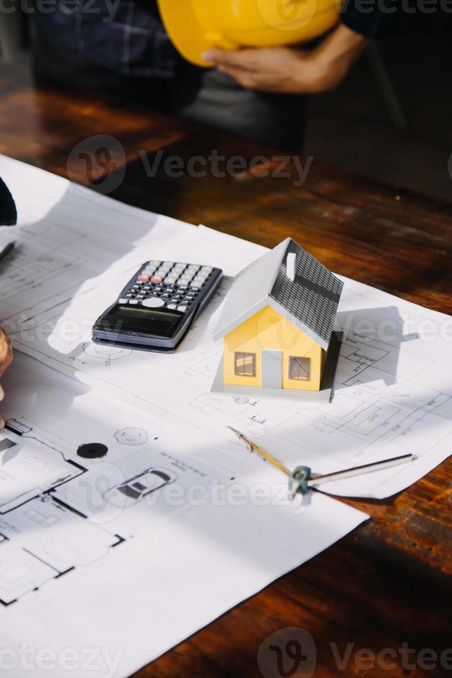Architect concept, Architects working with blueprints in the office, Vintage Effect photo