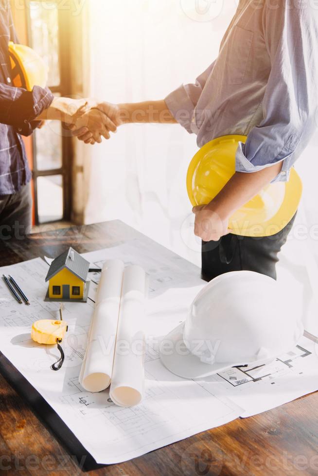 Architect concept, Architects working with blueprints in the office, Vintage Effect photo