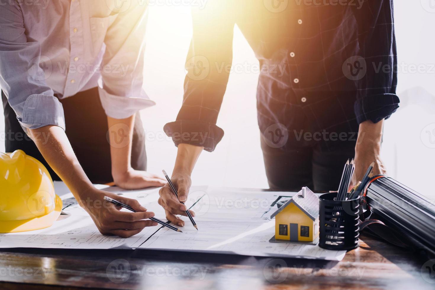 Architect concept, Architects working with blueprints in the office, Vintage Effect photo