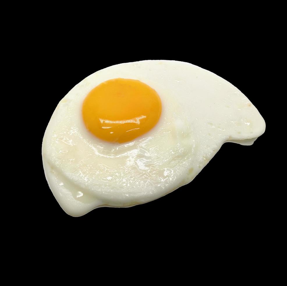 sunny side up egg isolated in black background photo