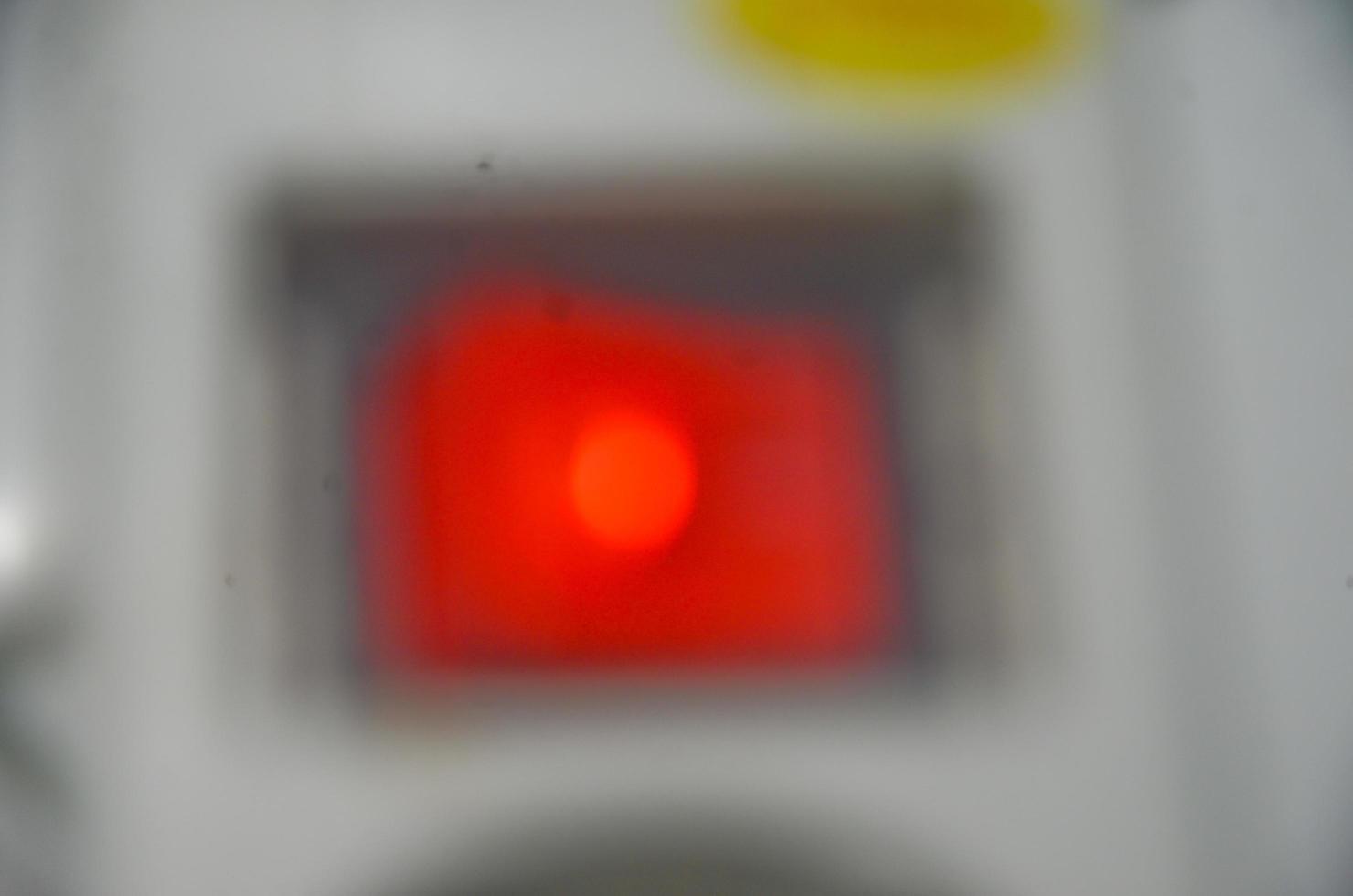 Abstract and blurred background of red lamp electric power button. photo