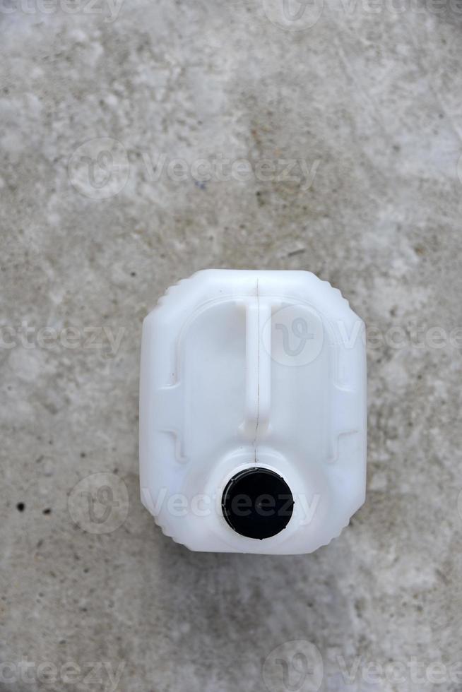 White plastic large canister. An empty plastic canister. photo