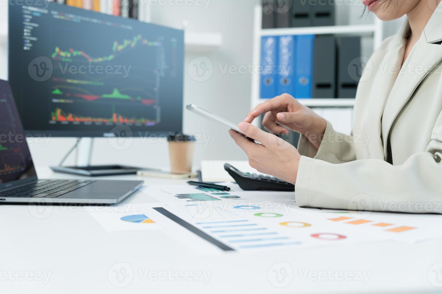 Business women calculate benefit, spreadsheets, graph financial development, bank accounts, statistics, economy, data analysis, investment analysis, stock exchange,Interest rates, income photo