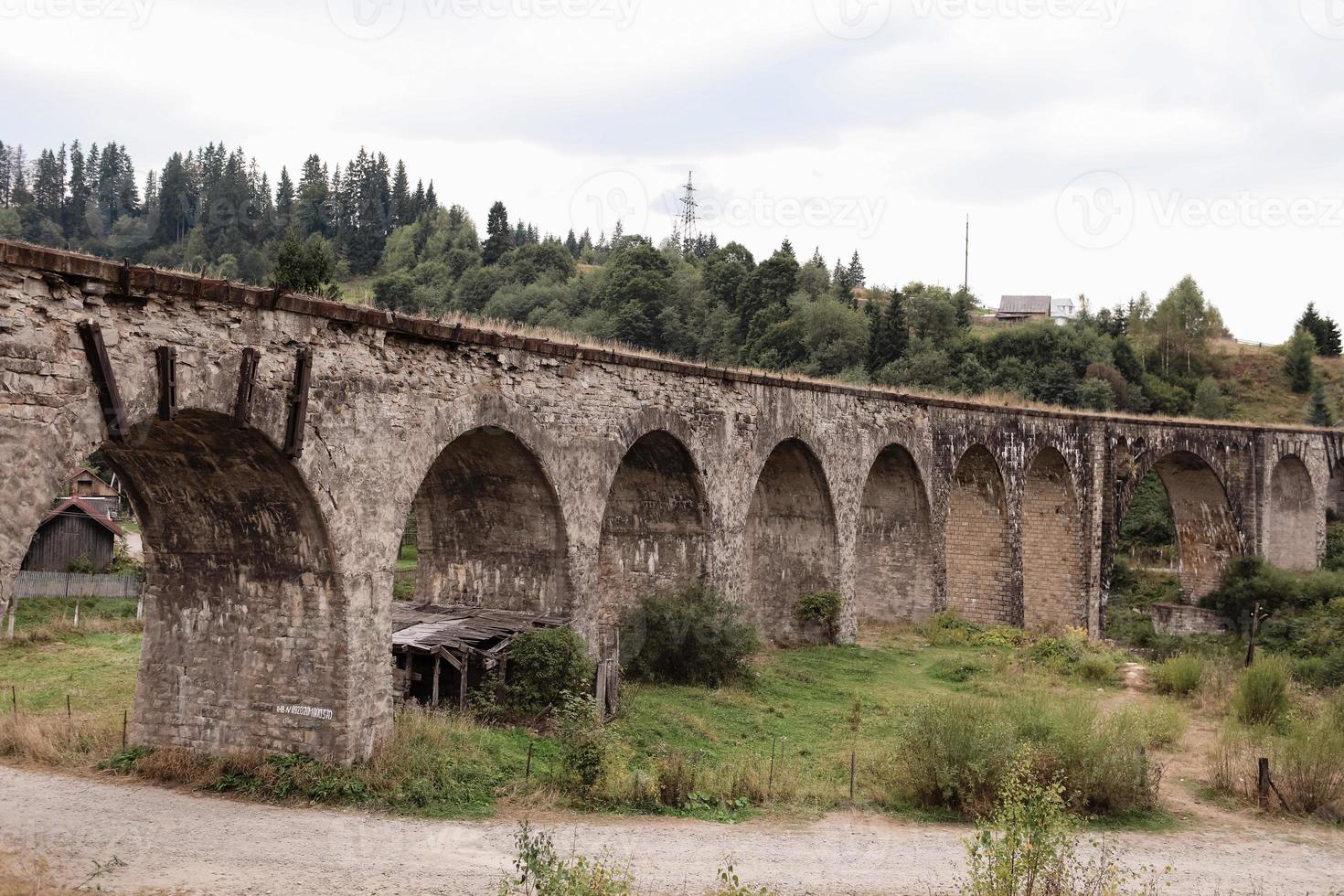 Old railway bridge, old viaduct Vorokhta, Ukraine. Carpathian Mountains, wild mountain landscape photo