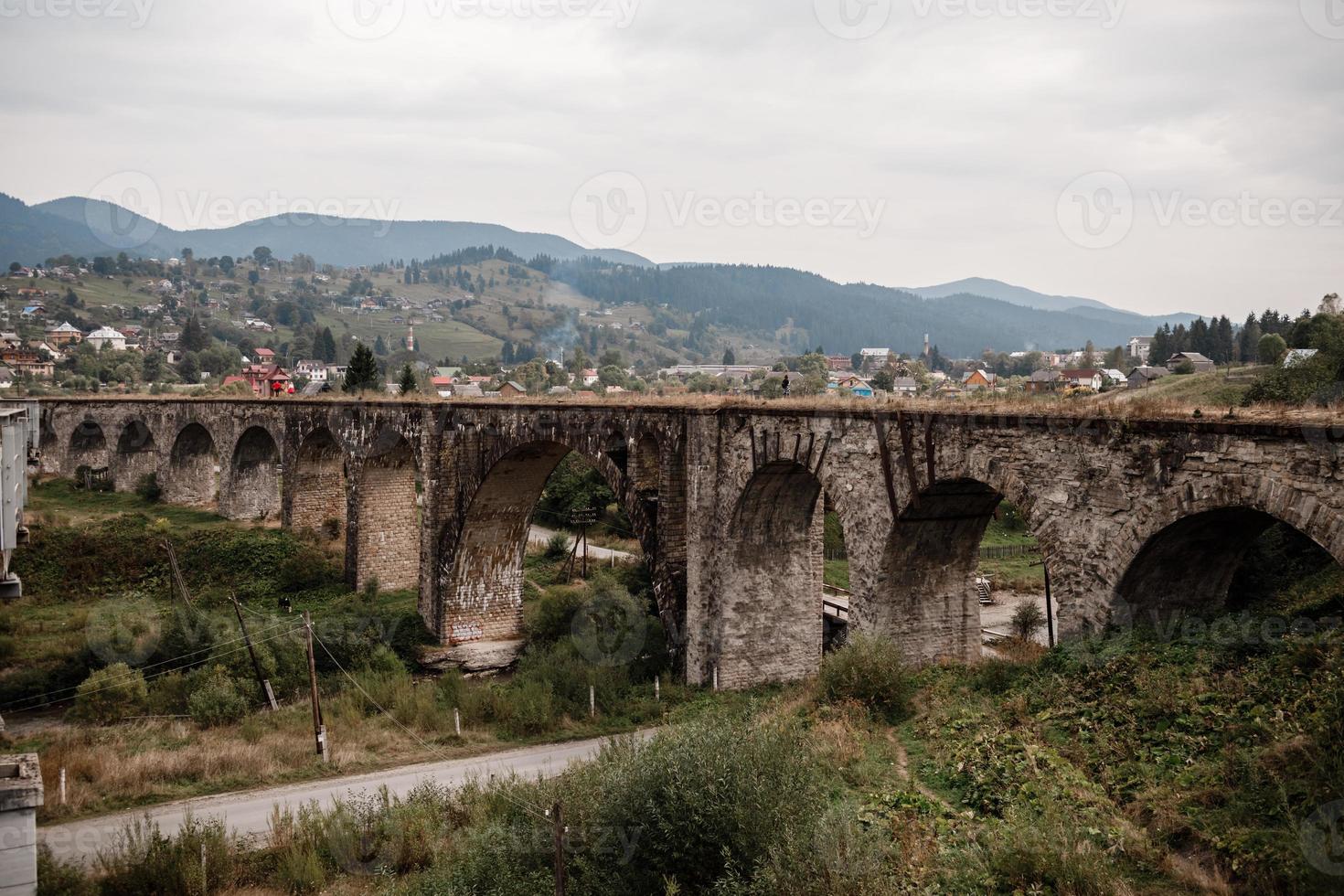 Old railway bridge, old viaduct Vorokhta, Ukraine. Carpathian Mountains, wild mountain landscape photo