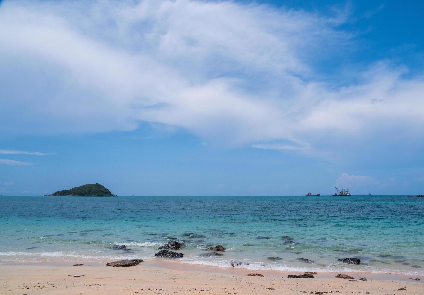 Landscape summer front view  tropical sea beach rock blue white sand background calm Nature ocean Beautiful wave crash splashing water travel Nang Ram Beach East thailand Chonburi Exotic horizon. photo