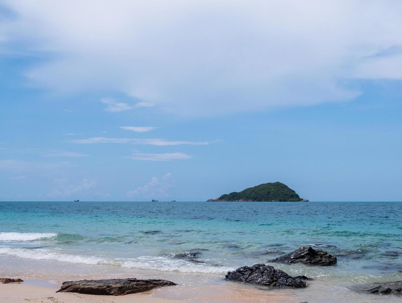 Landscape summer front view  tropical sea beach rock blue white sand background calm Nature ocean Beautiful wave crash splashing water travel Nang Ram Beach East thailand Chonburi Exotic horizon. photo