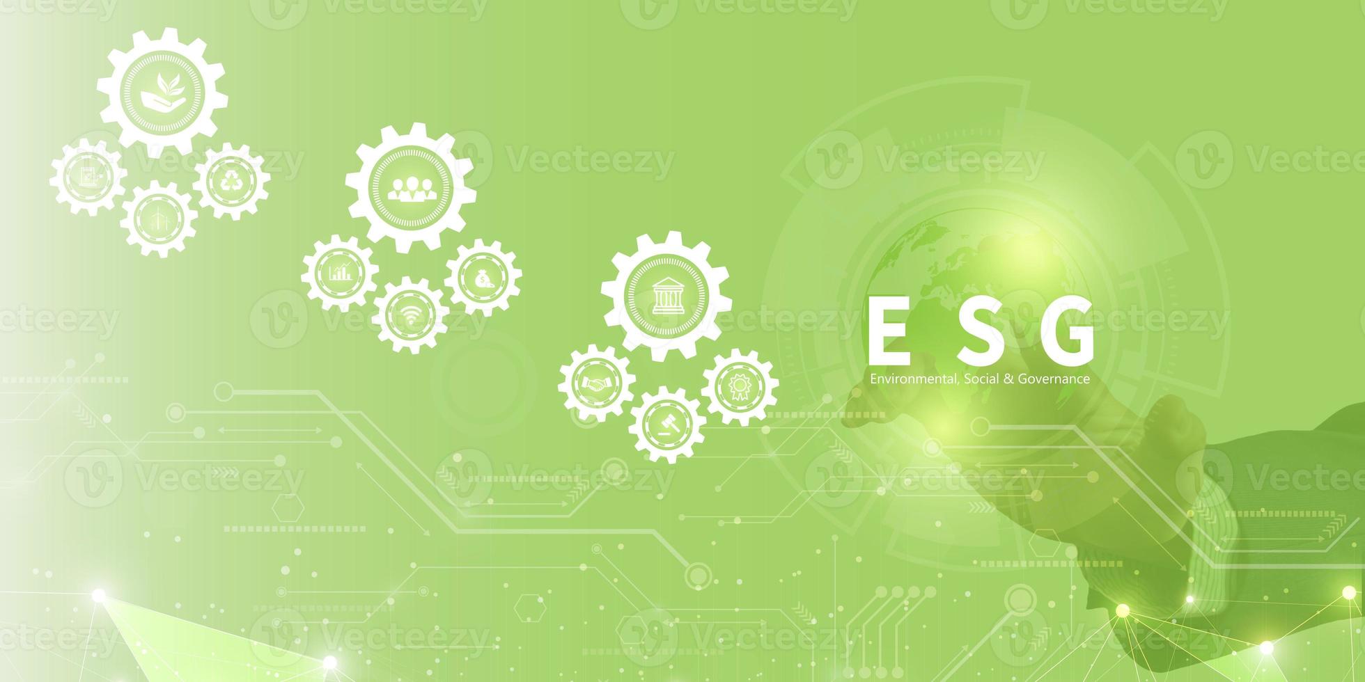 Businessman touching ESG icon on virtual screen for environmental, social, and governance in sustainable and ethical business on a technology green background. photo