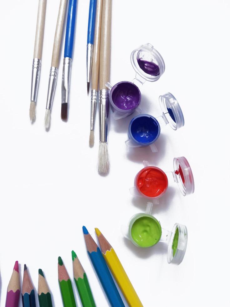 art supplies, colored pencils paint brushes and paints photo