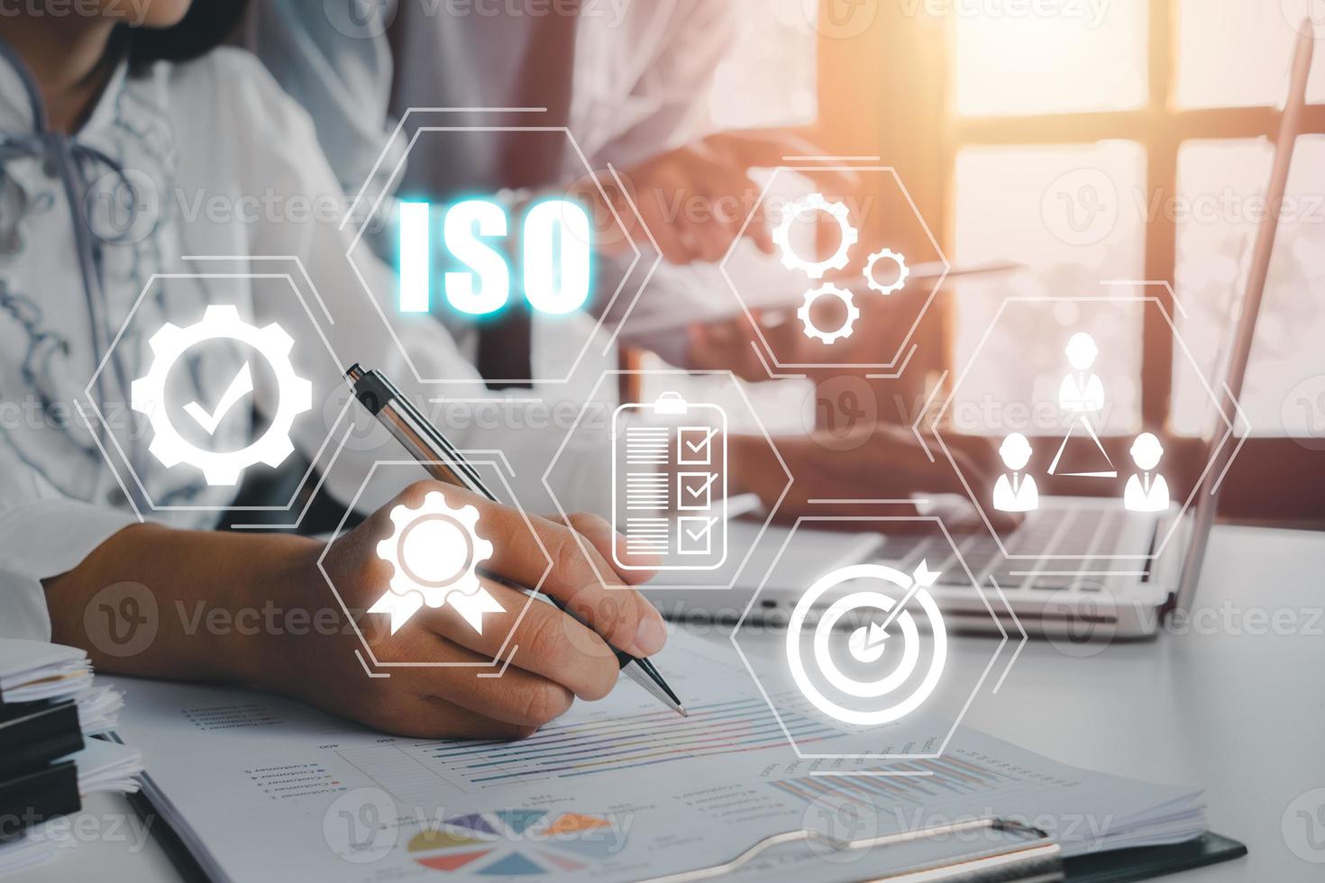 ISO standards quality control concept, Business team discussing data and document data with VR screen quality management iso icon on desk table, Assurance warranty, Business technology concept. photo