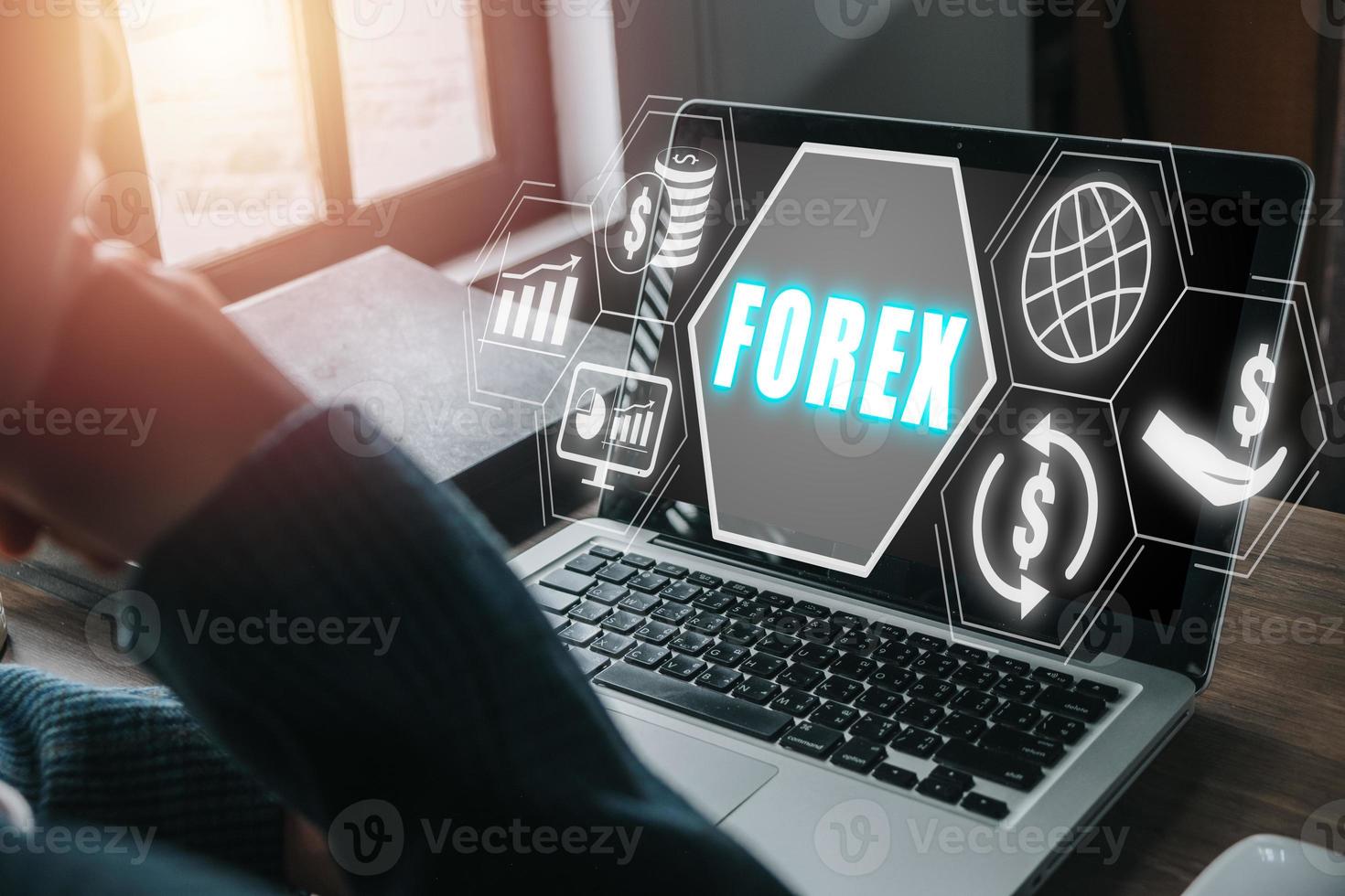 Forex trading, Young man using smartphone and laptop computer with Forex icon on VR screen on desk, Online investment. Business, internet and technology concept. photo
