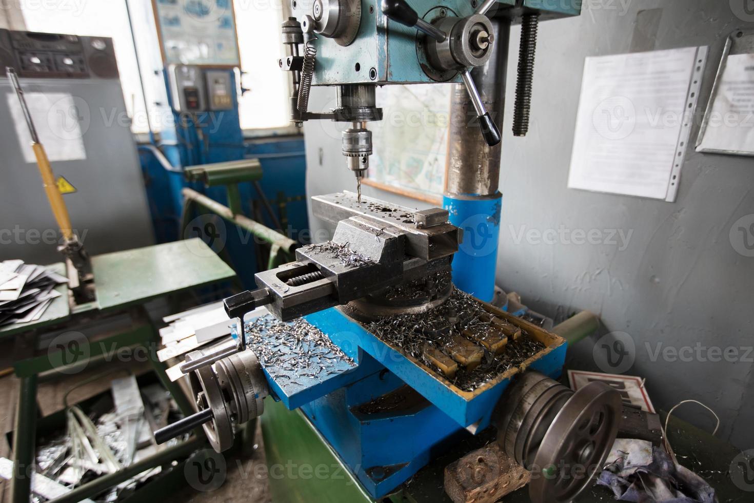 An old-style lathe in the workshop. photo