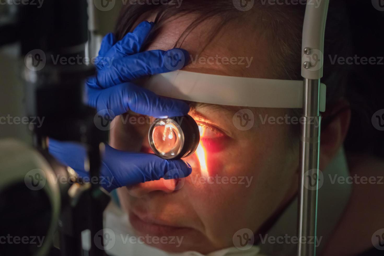 An ophthalmologist checks the fundus of the patient. photo