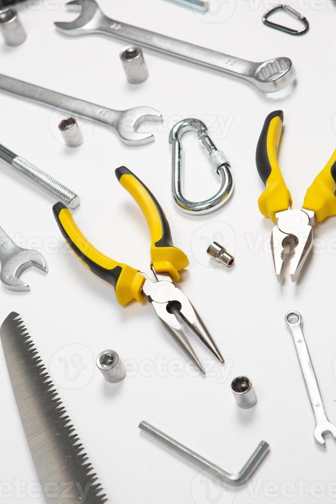 Set of tools for repair in a case on a white background. Assorted work or construction tools. Wrenches, Pliers, screwdriver. Top view photo