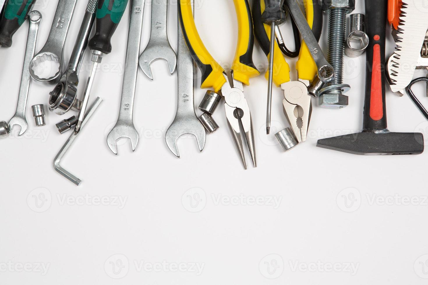 Set of tools for repair in a case on a white background. Assorted work or construction tools. Wrenches, Pliers, screwdriver. Top view photo