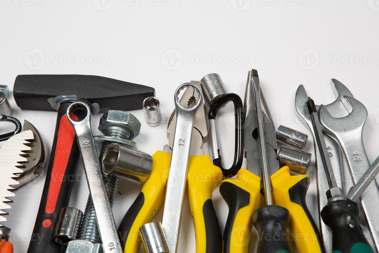 Set of tools for repair in a case on a white background. Assorted work or construction tools. Wrenches, Pliers, screwdriver. Top view photo