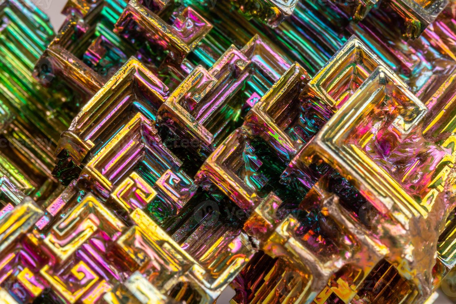 Macro of the mineral bismuth stone on a white background photo