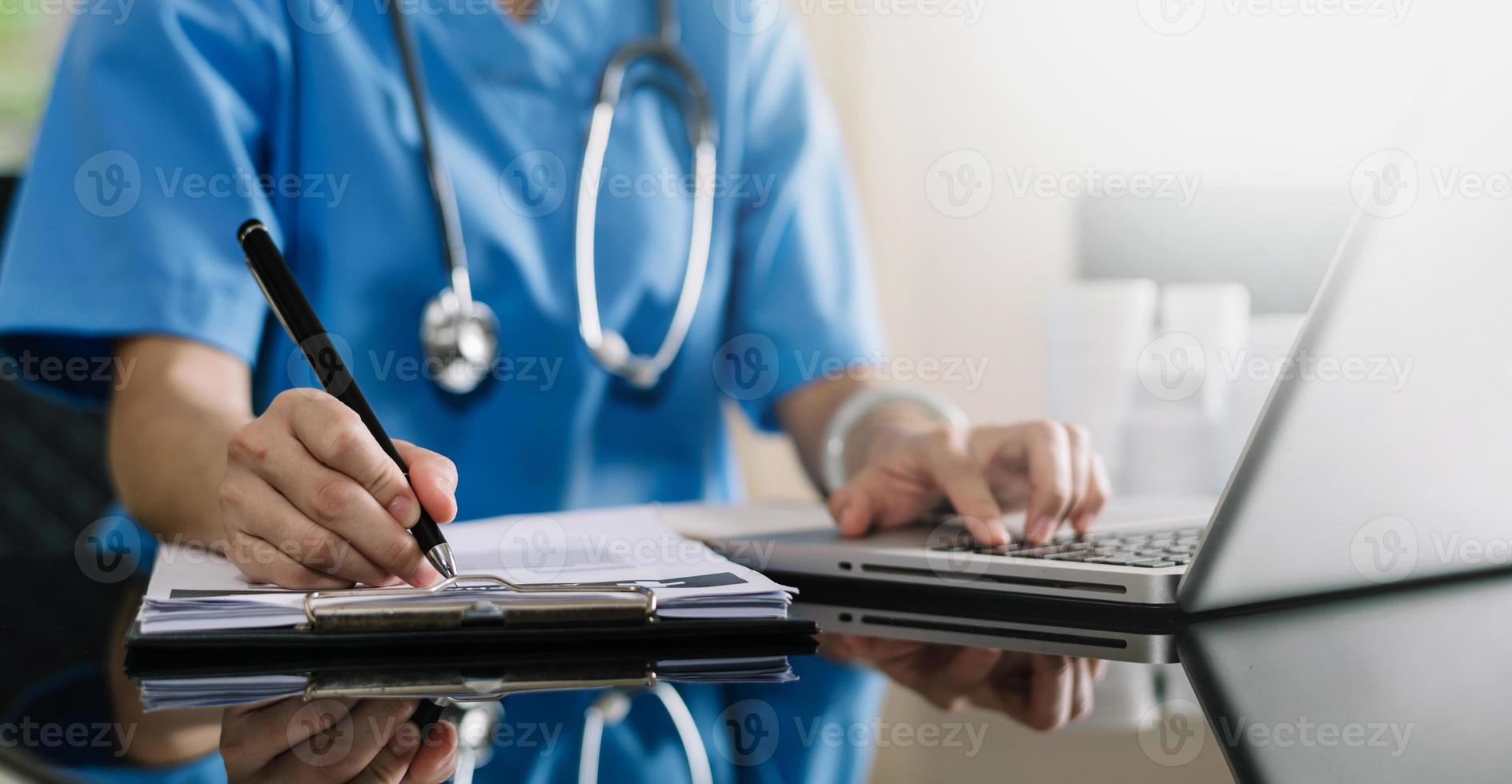 Medicine doctor hand working with modern digital tablet computer interface as medical network concept in office photo