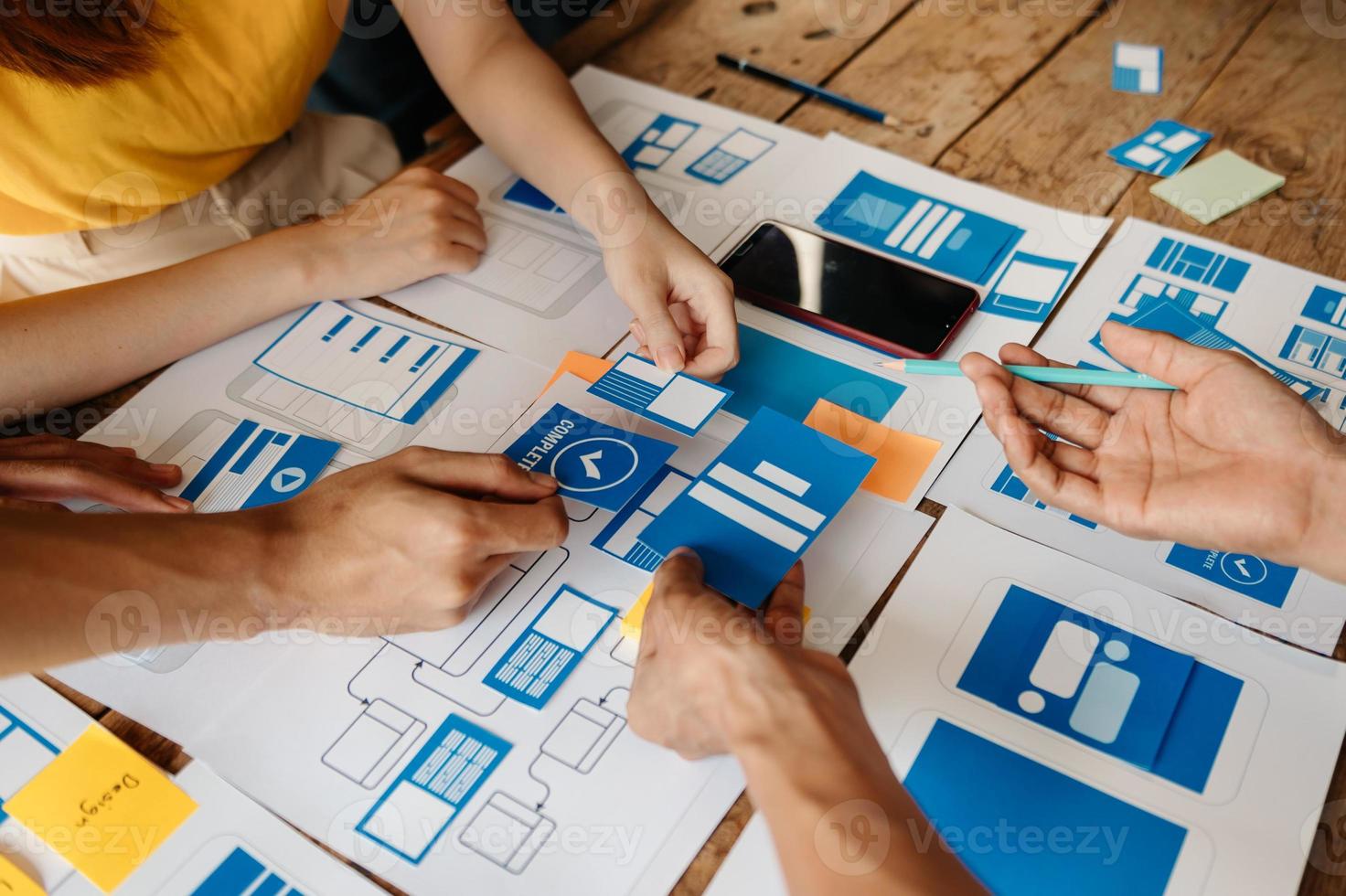 UX graphic designer planning application process development prototype wireframe for web smart phone. Creative digital development agency. photo