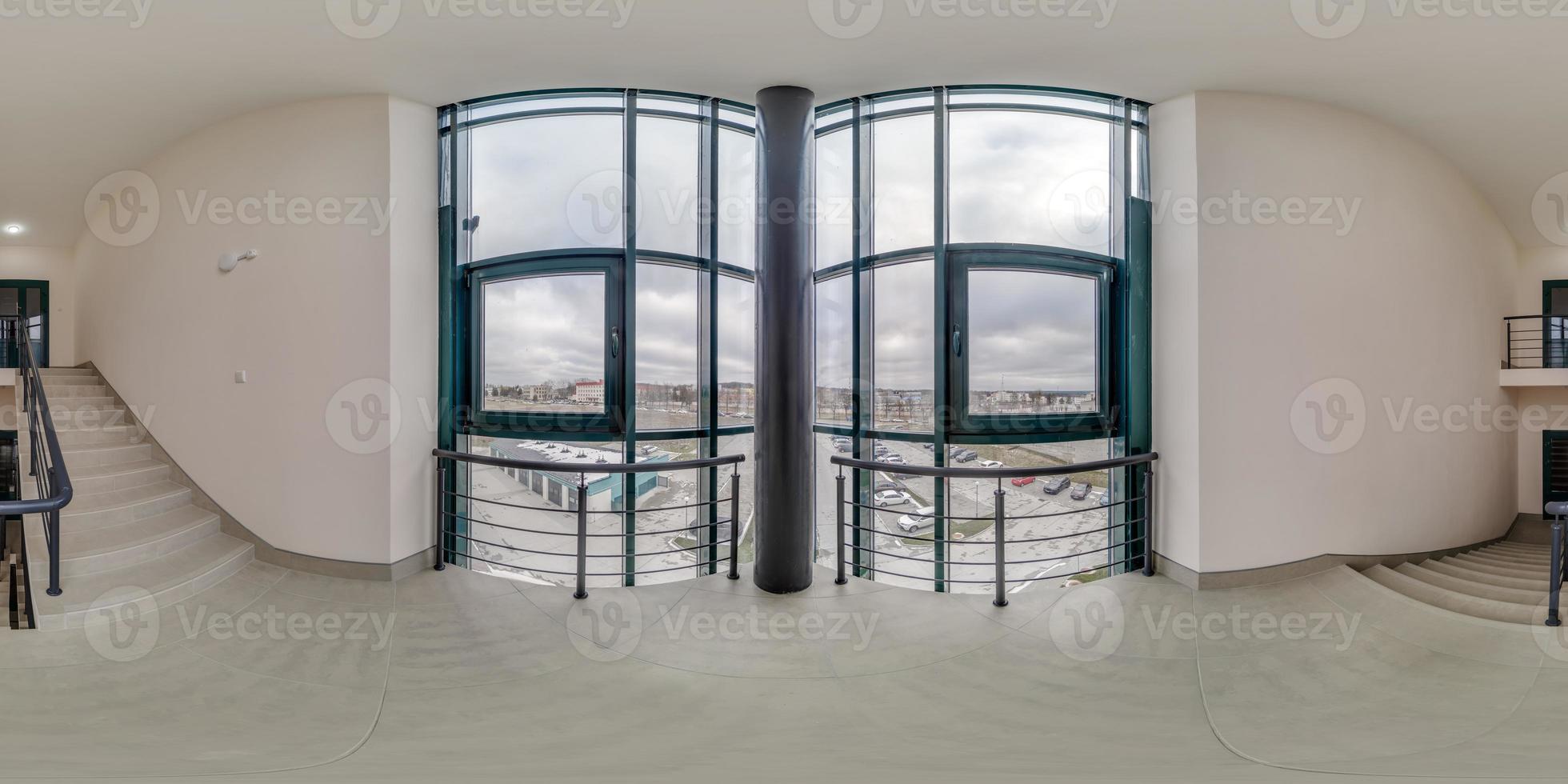 full spherical hdri 360 panorama view in empty modern hall near panoramic windows with columns, staircase and doors in equirectangular projection, ready for AR VR content photo