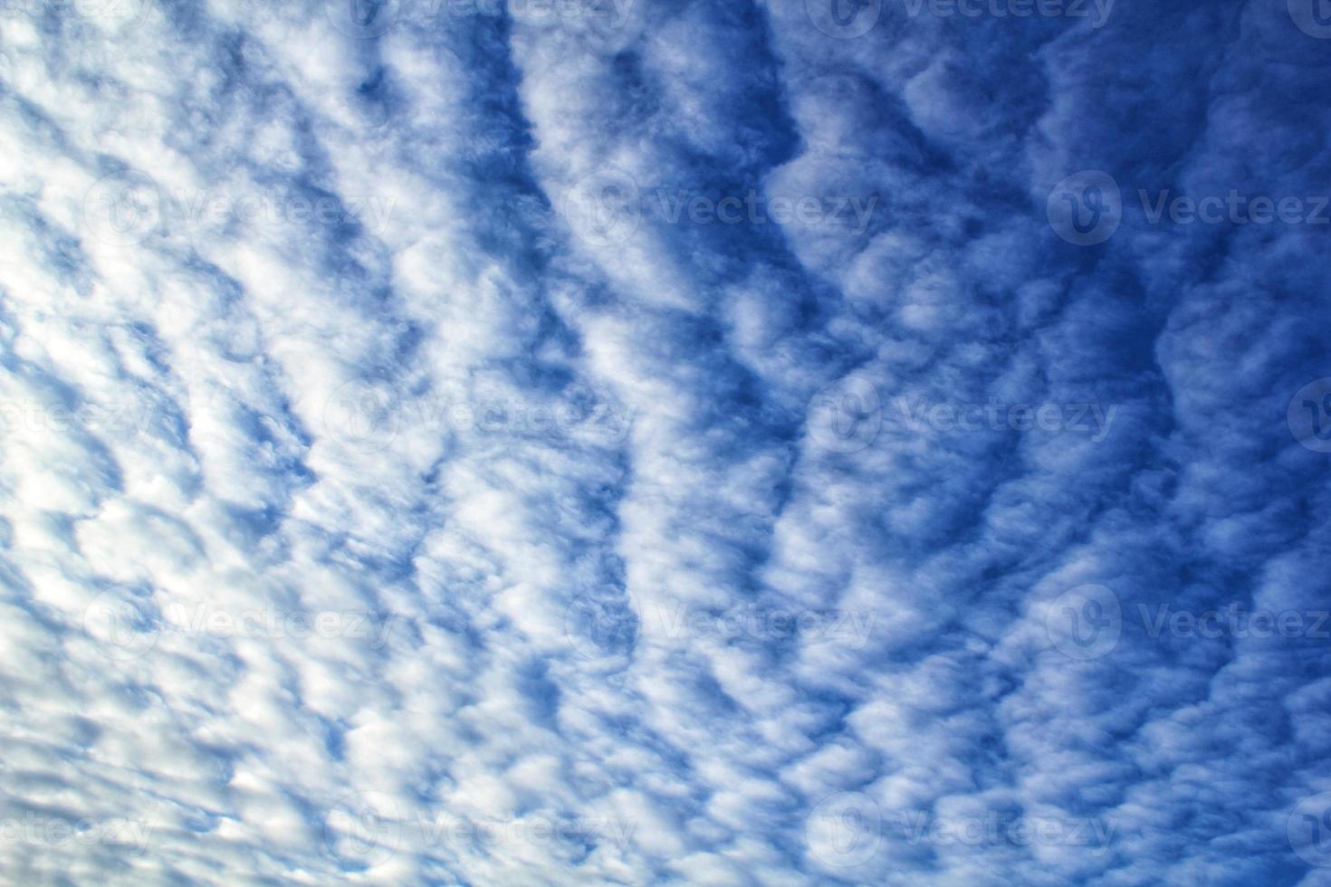 White light soft clouds floating in blue sky. Nature morning landscape background. Clear spring wind. Bright summer day. Winter calm air skyscape. Abstract panorama. Change climate. Low angle view photo