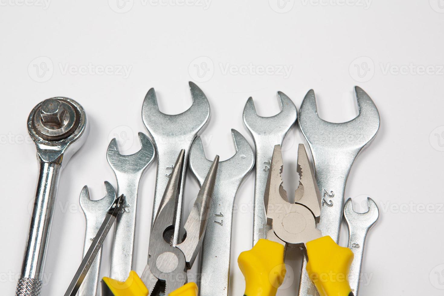 Set of tools for repair in a case on a white background. Assorted work or construction tools. Wrenches, Pliers, screwdriver. Top view photo