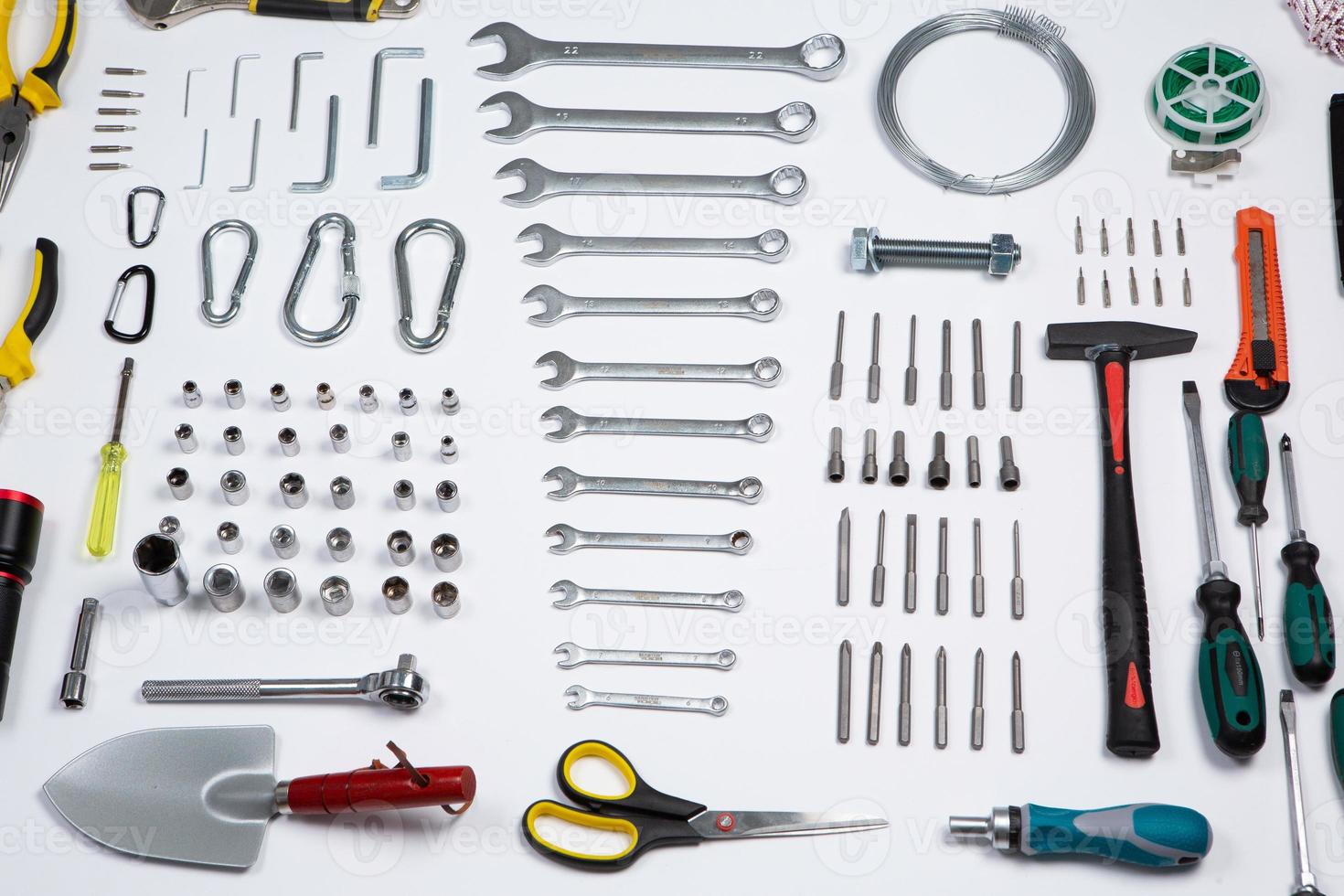 Set of tools for repair in a case on a white background. Assorted work or construction tools. Wrenches, Pliers, screwdriver. Top view photo