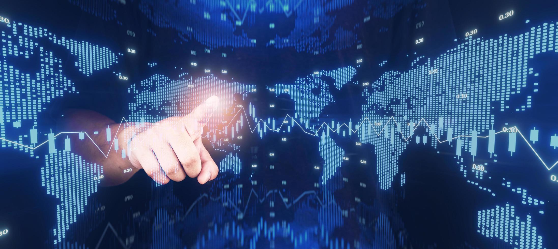 concept businessman point digital hologram Stock market investment trading world map financial chart with candlestick line graph on dark blue panorama background. 3d illustration double exposure style photo