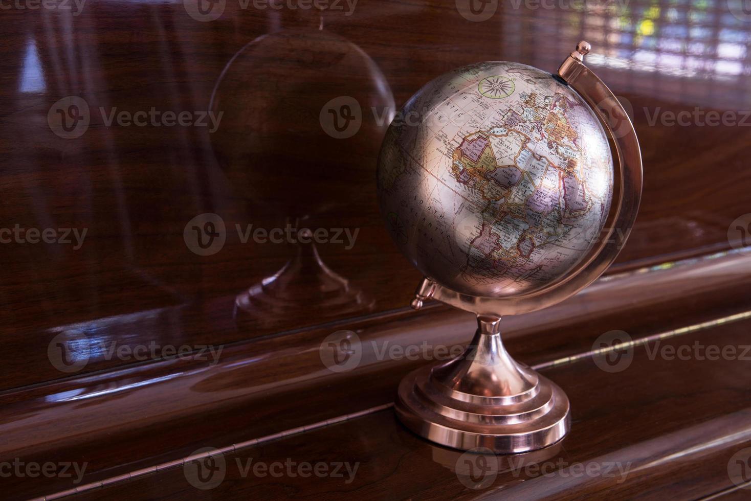 Plastic globe stand showing map photo