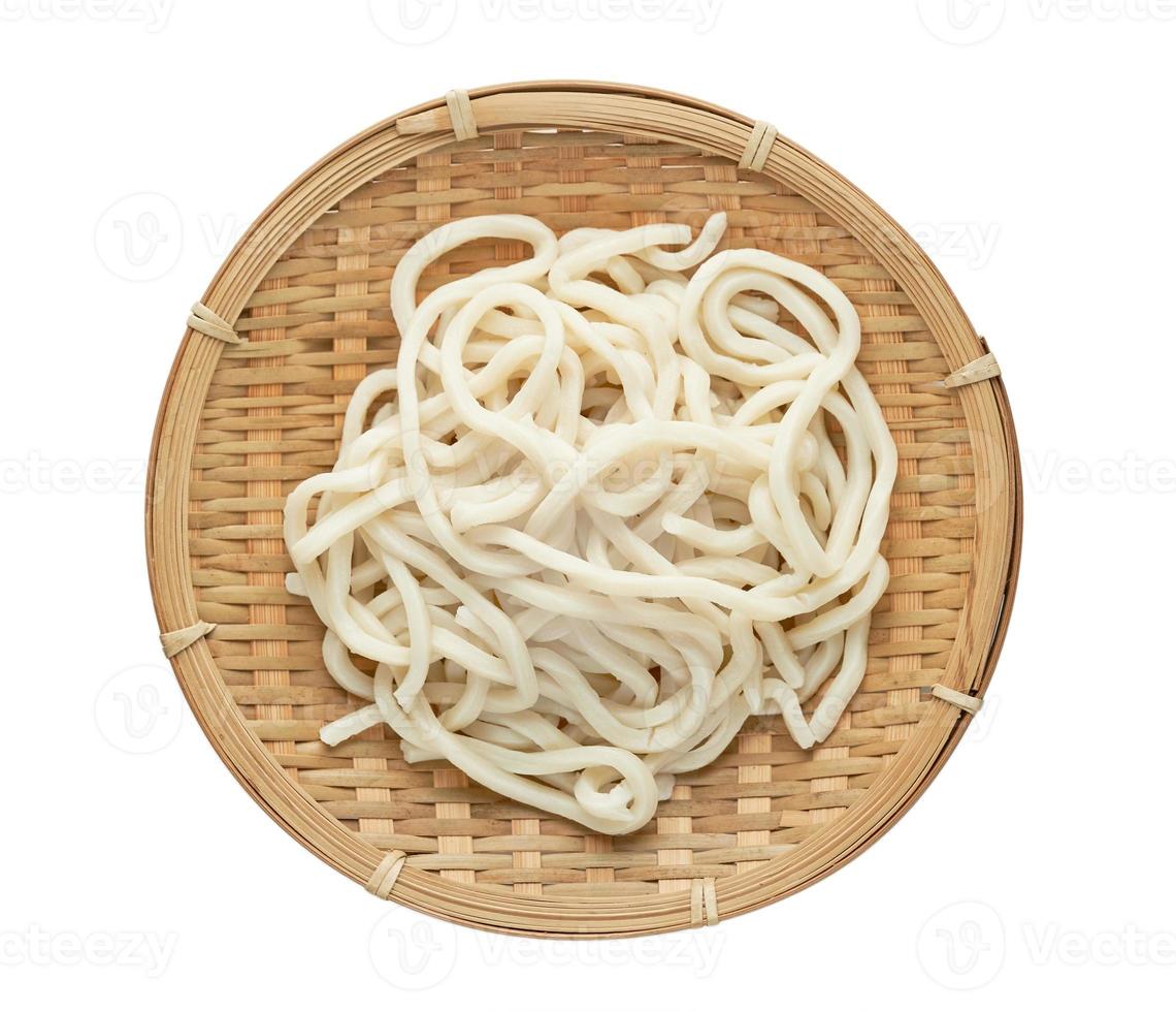 top view or flat lay udon noodle in wood bowl isolated on white background with clipping path photo