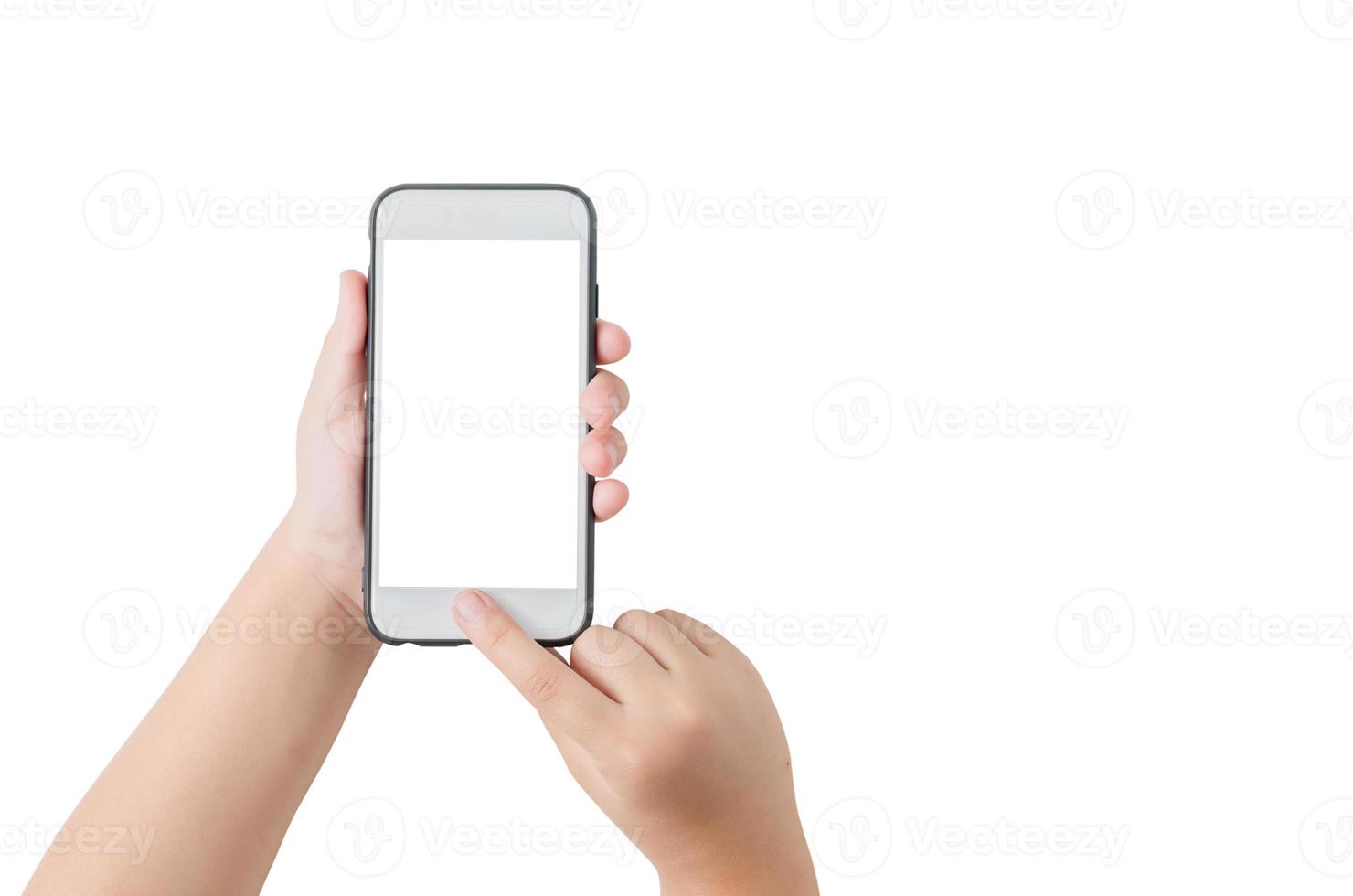 child hand hold mobile phone and touch on screen photo
