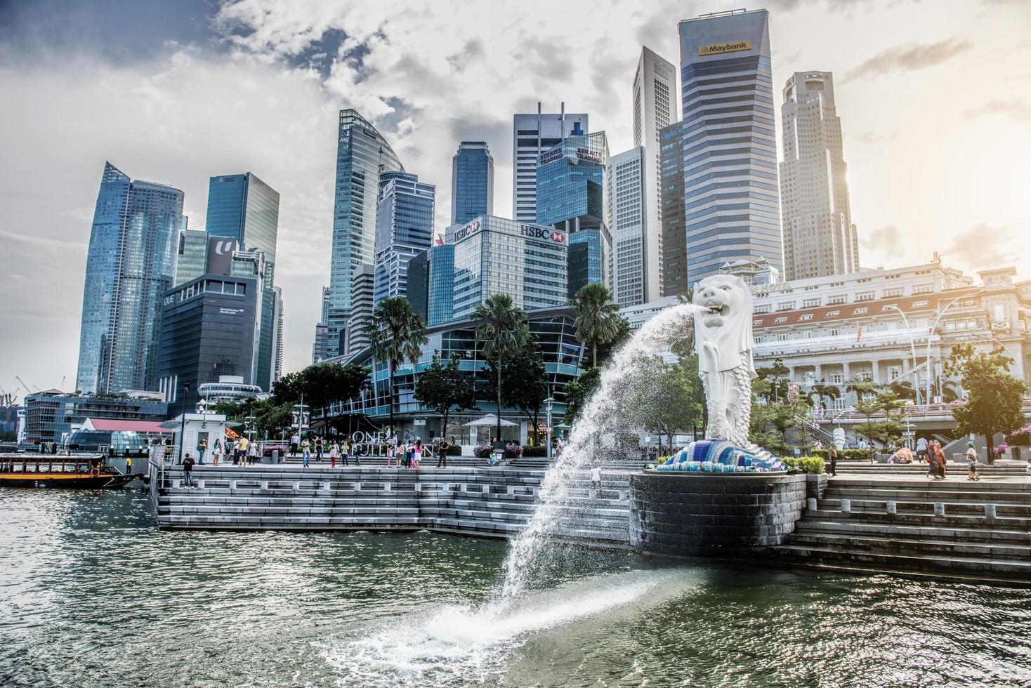 SINGAPORE-OCT 28-The Merlion fountain and Marina Bay Sand on OCT, 28, 2014. Merlion is an imaginary creature with a head of a lion and the body of a fish and  symbol of Singapore. photo